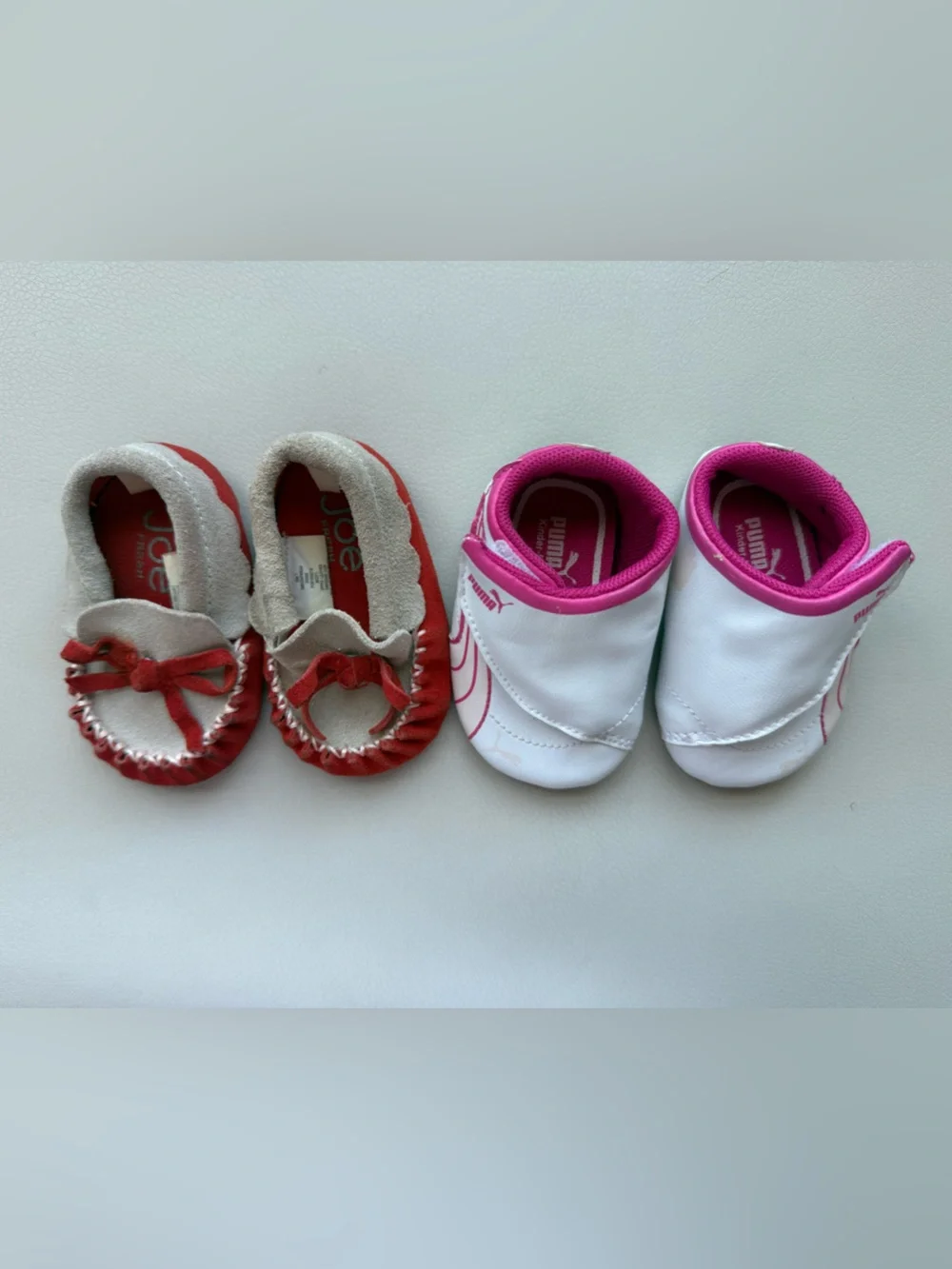 Puma White/ Pink Infant Slip-On Sneakers and brown baby moccasins with orange